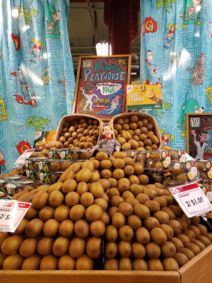 Kiwi's Playhouse display of gold and green kiwis at East End Food Co-op
